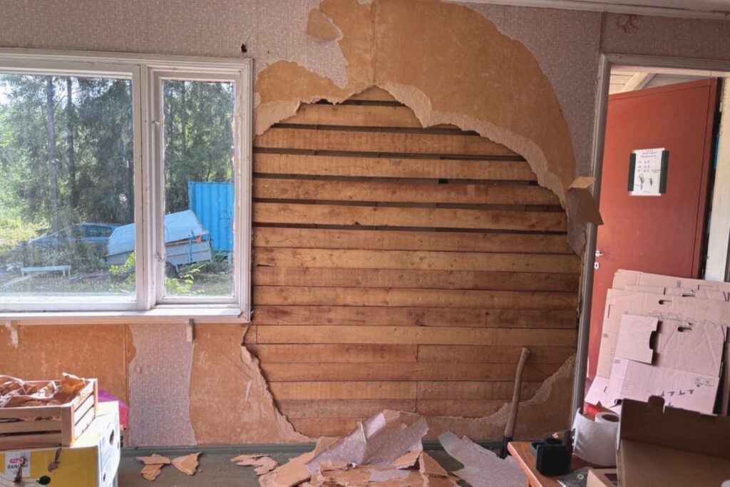 Interior wall demolition during a Finnish cottage renovation